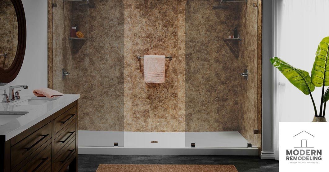 A bathroom with a walk in shower and a sink.