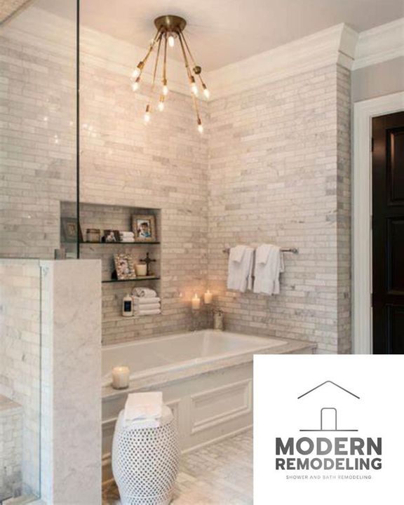 A bathroom with a bathtub and a modern remodeling logo