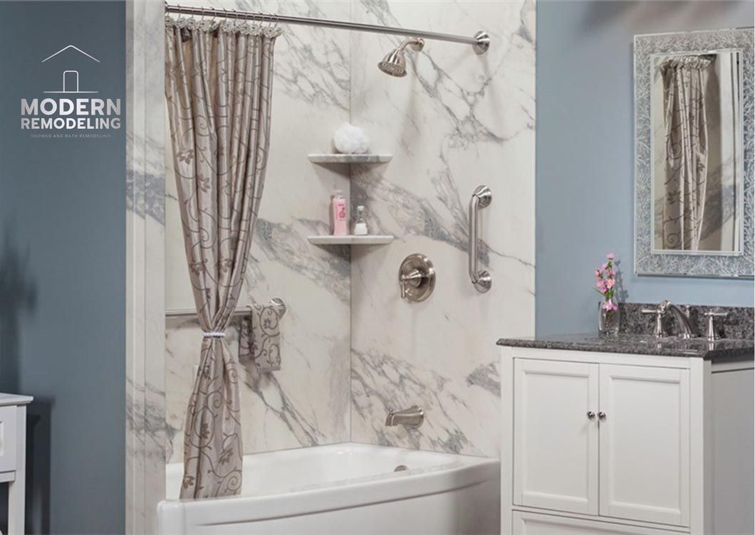 A bathroom with a bathtub , sink , mirror and shower curtain.
