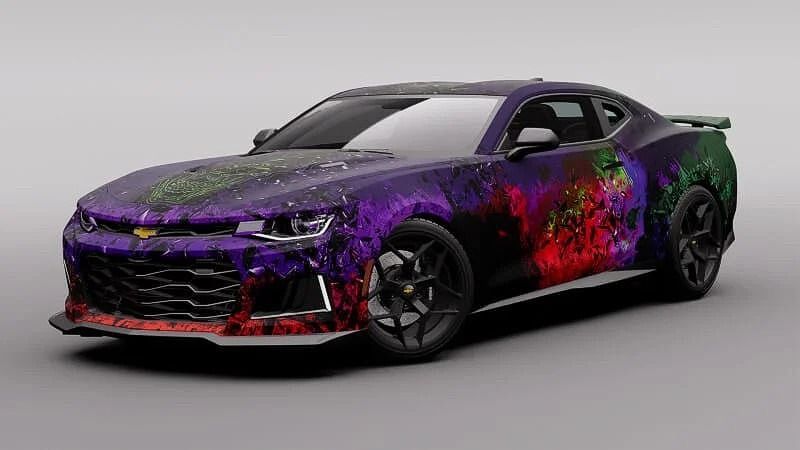 Purple and red custom paint on a Chevrolet Camaro. The car is parked on a gray surface.