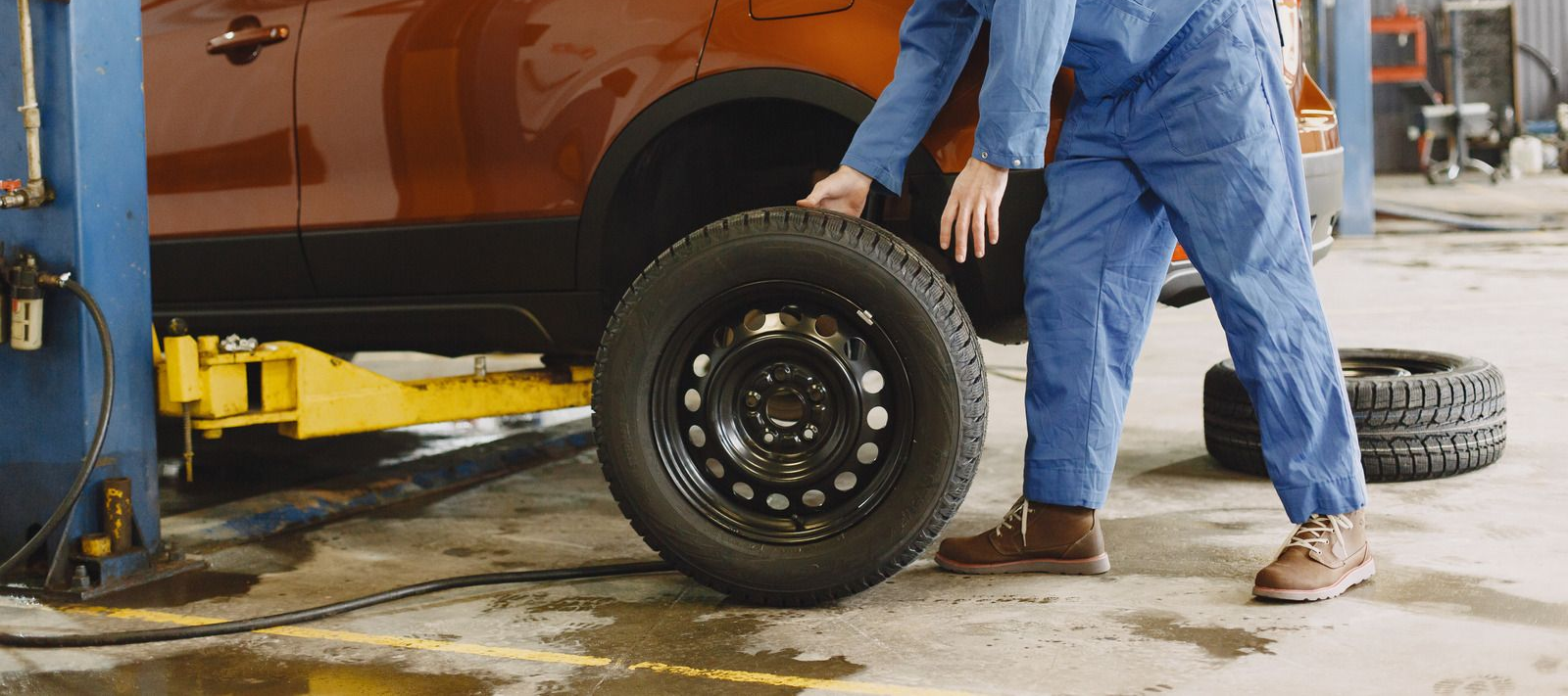 A black truck is parked on the side of the road