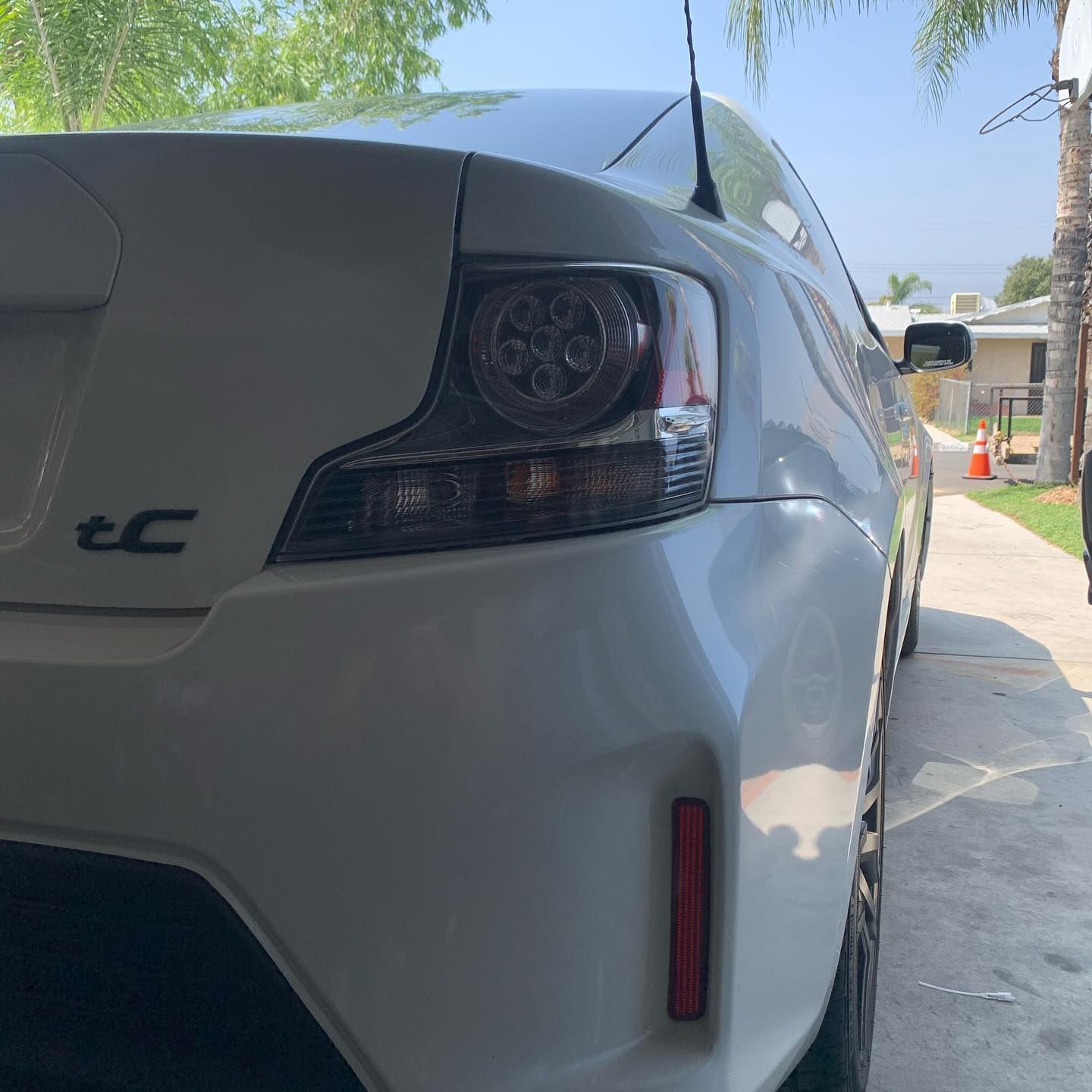 A white car with the word ec on the back