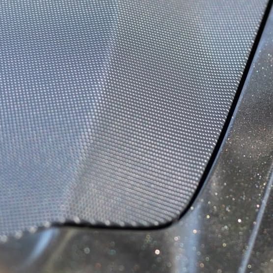 A close up of a screen on a car windshield