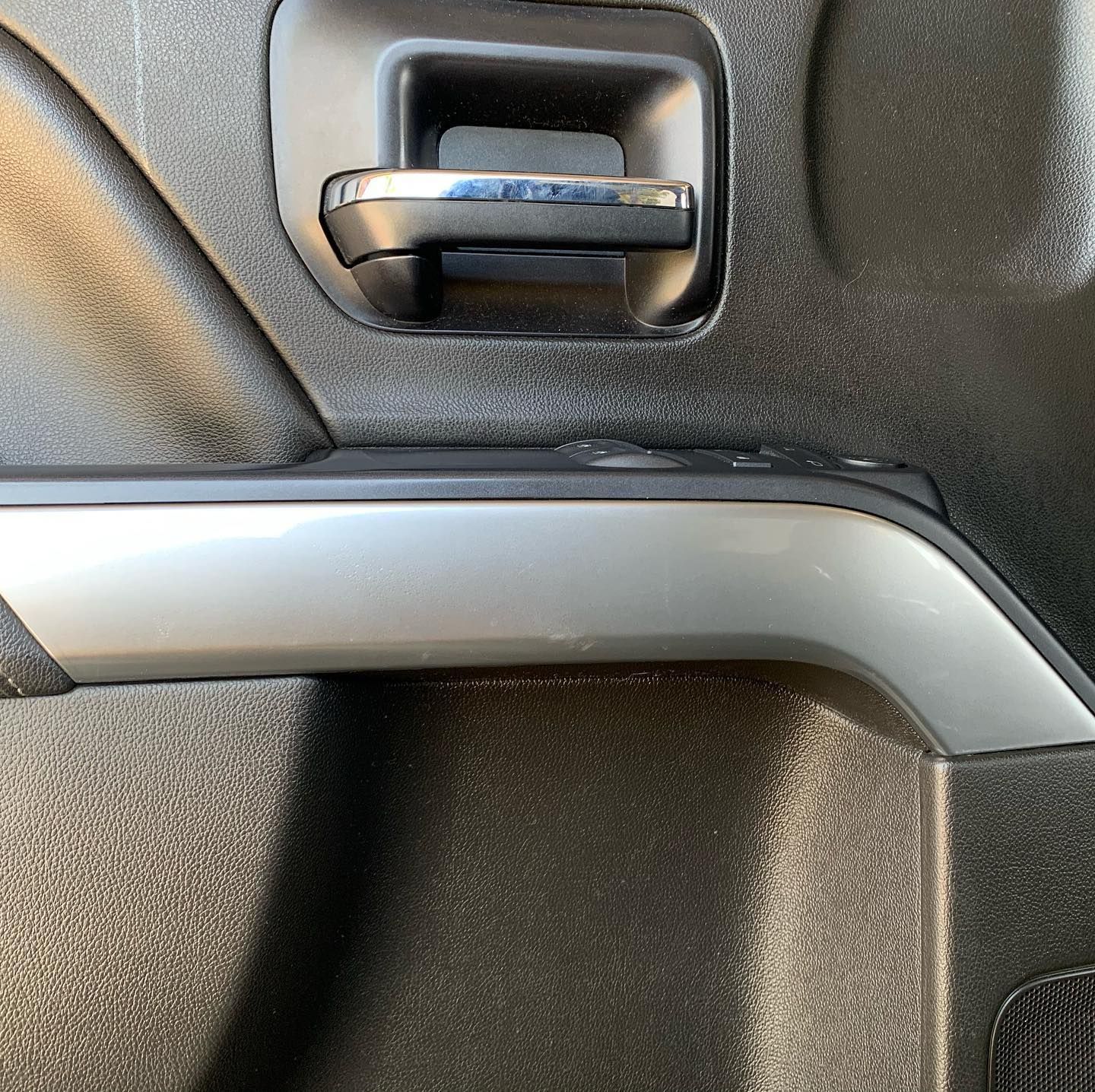 A close up of a door handle on a car