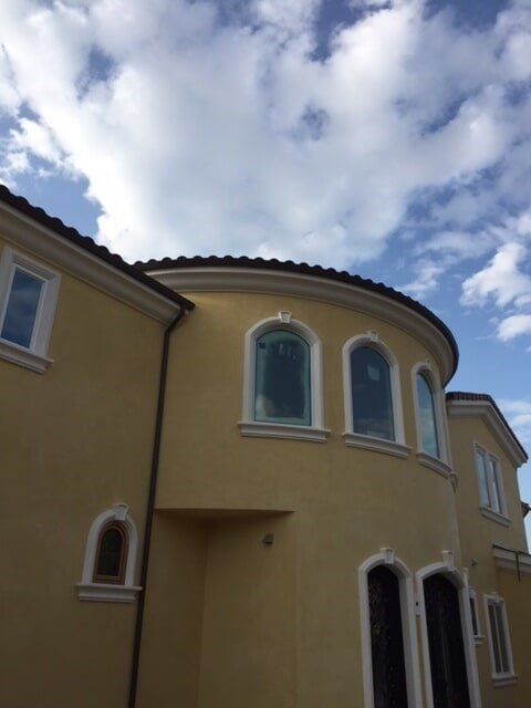 Rain Gutter on Yellow House — Residential Gutters in Escondido, CA