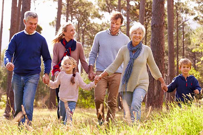 Family Walking In The Countryside — Local And Nationwide Memorial Services in Fraser, Michigan