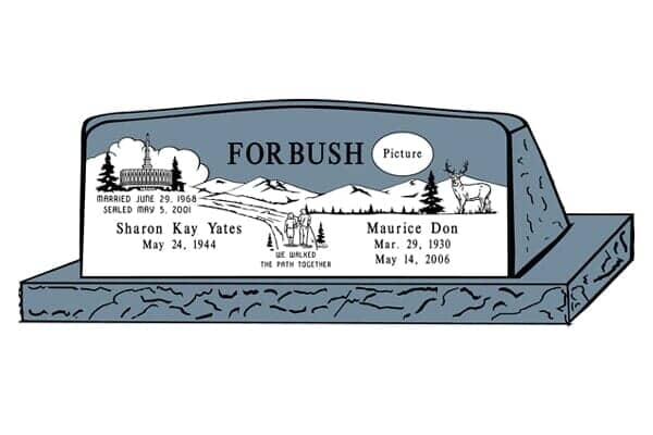 A blue granite tombstone engraved with names, dates, artwork of a landscape, church, and deer.