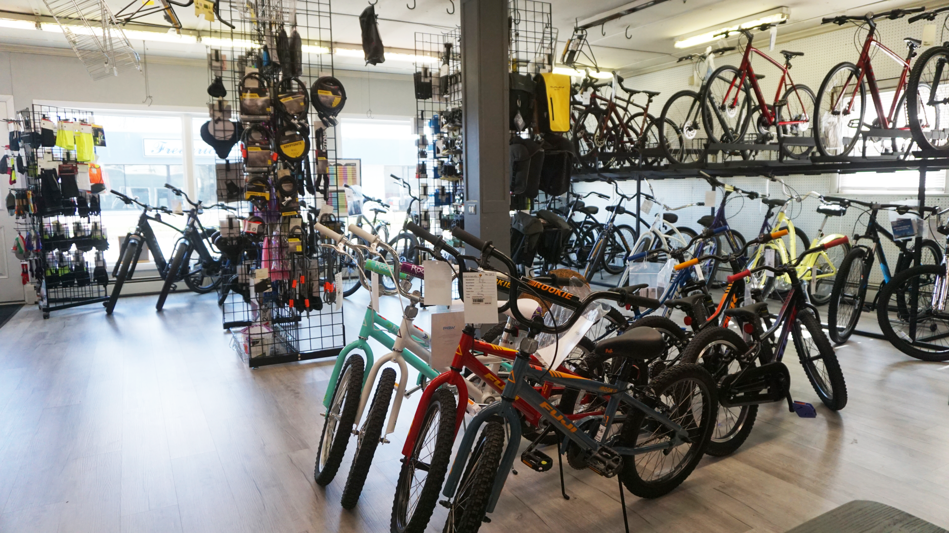A bicycle store filled with lots of bicycles on display.