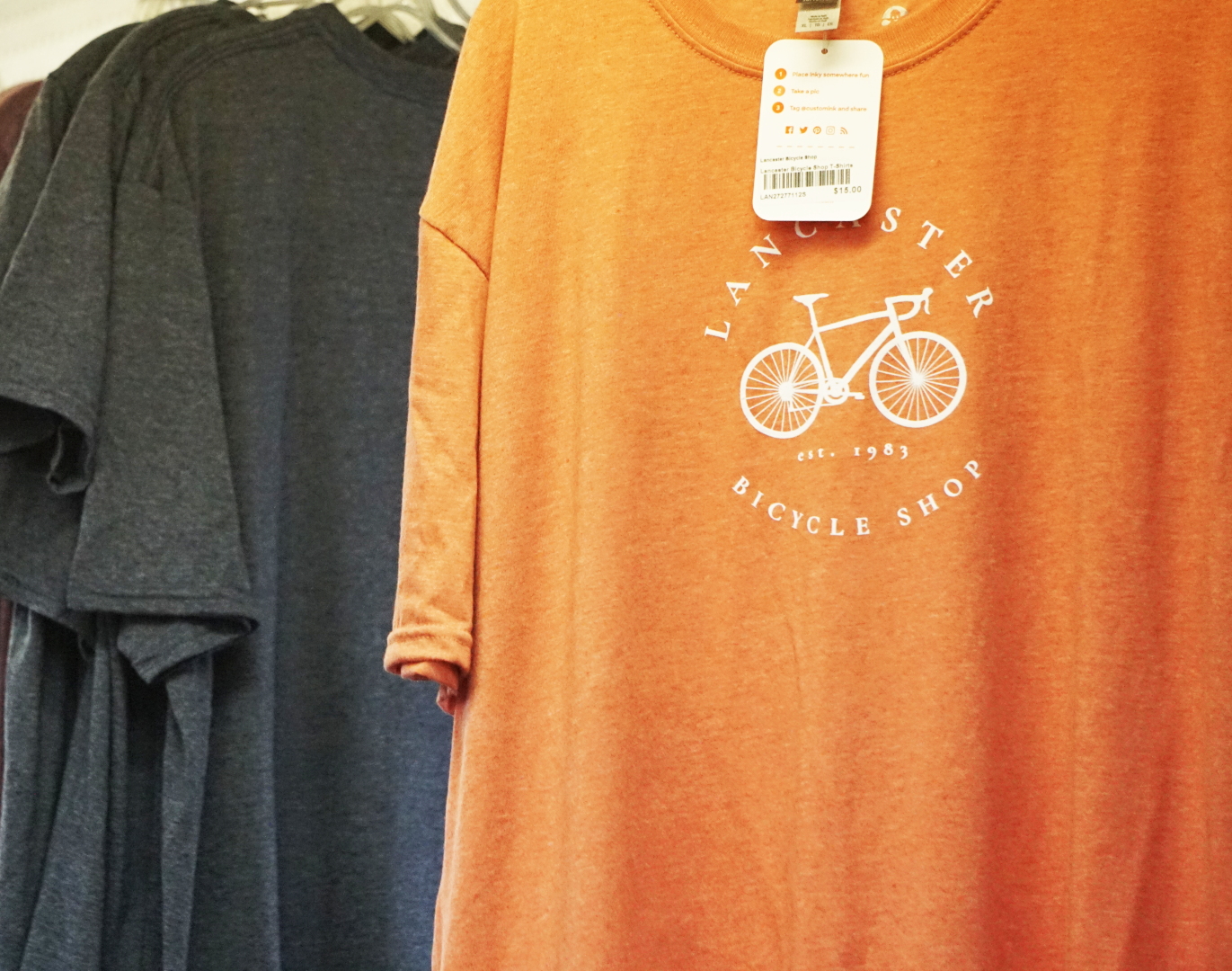 A t-shirt that says bicycle shop on it