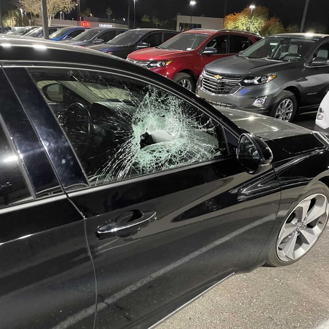 Broken door glass in need of mobile auto glass repair.