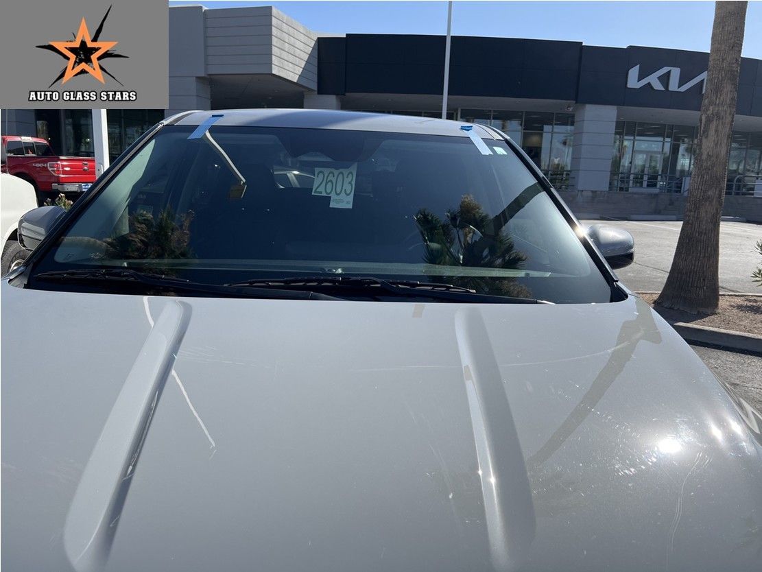 A new windshield replaced on a Kia.