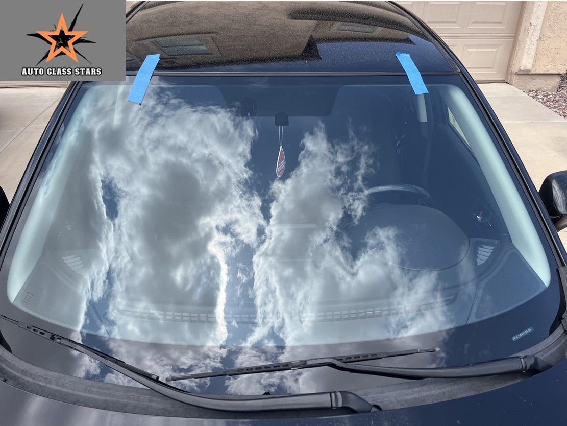 A black Mazda with a clean new windshield installed in Florence, Arizona.