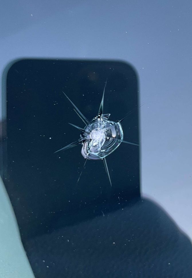 Windshield chip repair of cracks from a rock impact.