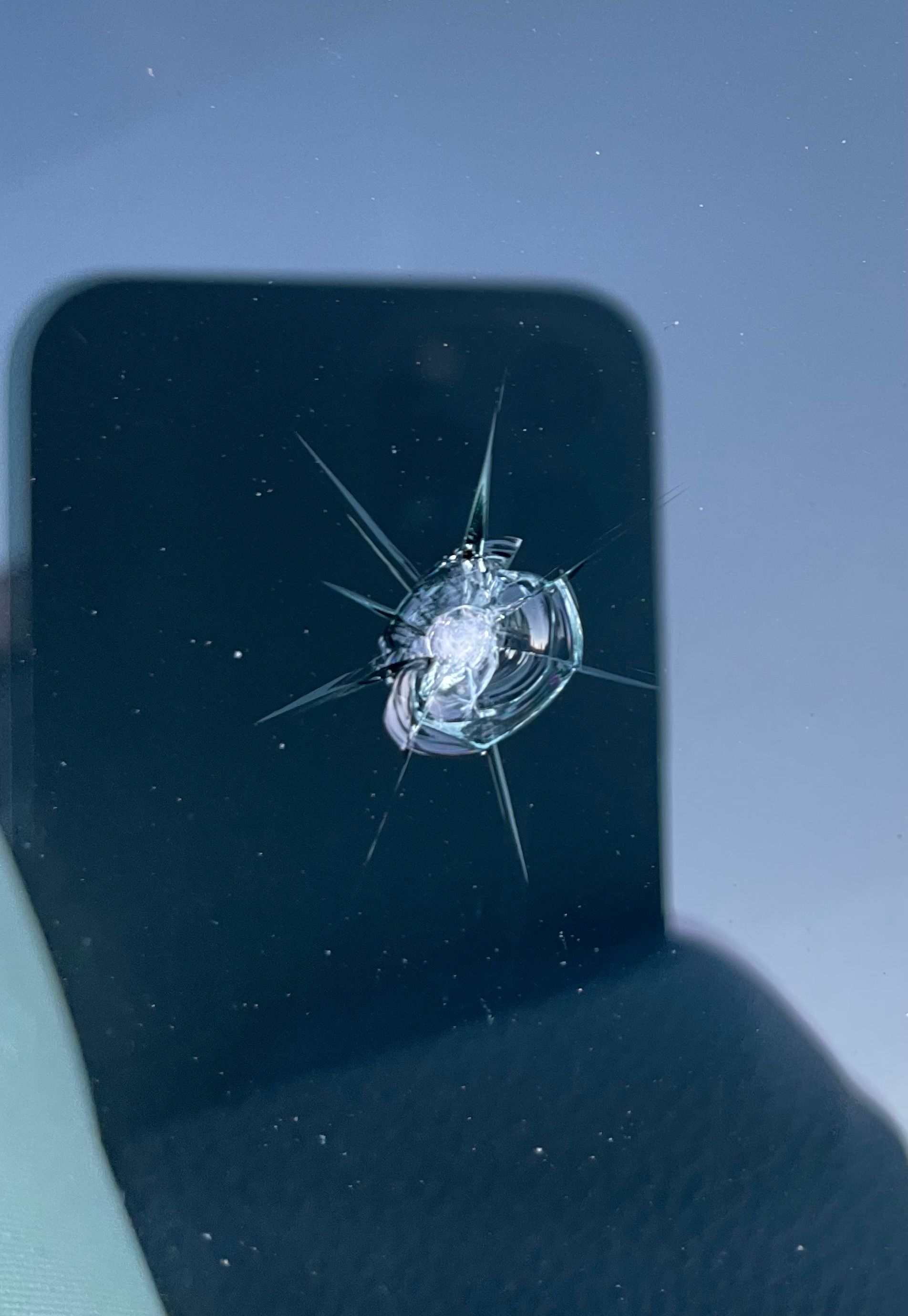 Windshield rock chip before being repaired.