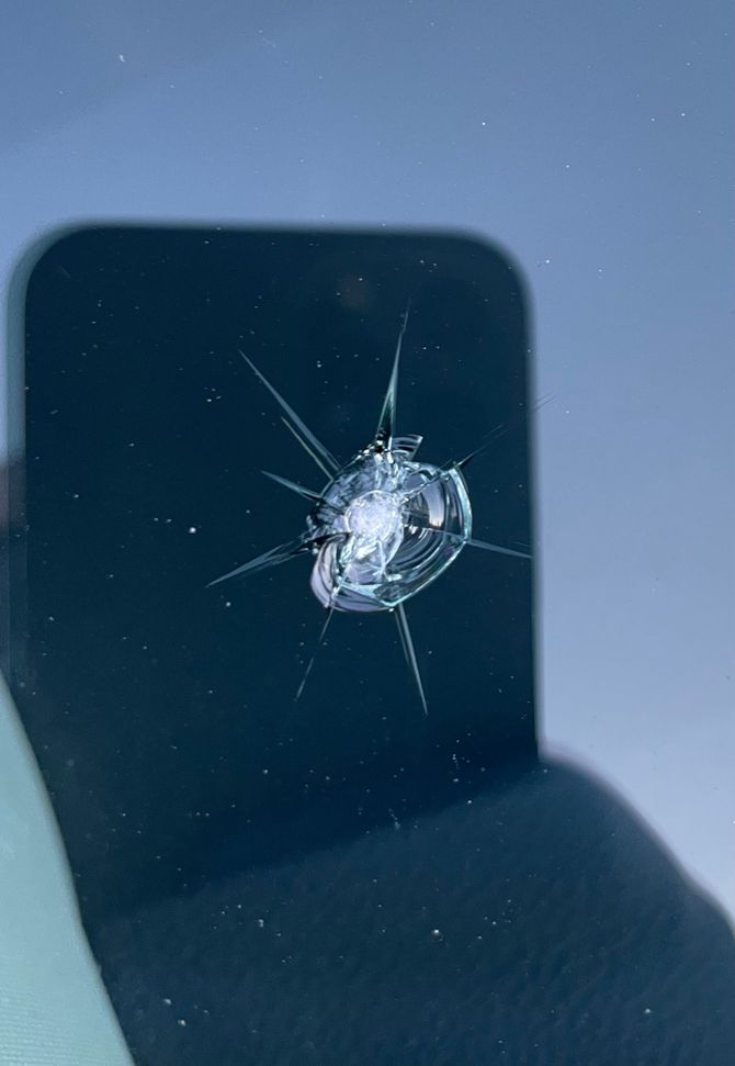 Windshield chip repair of cracks from a rock impact.