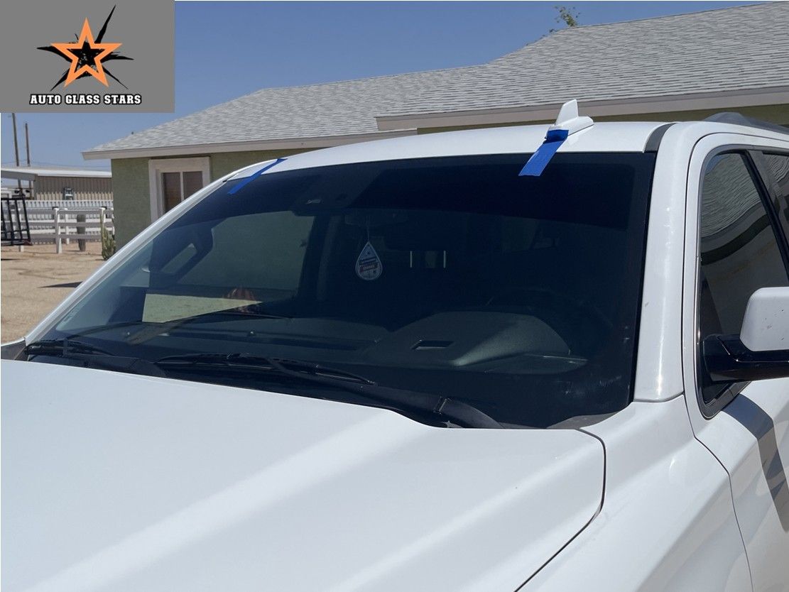 White truck with a tinted windshield replaced in Florence, AZ