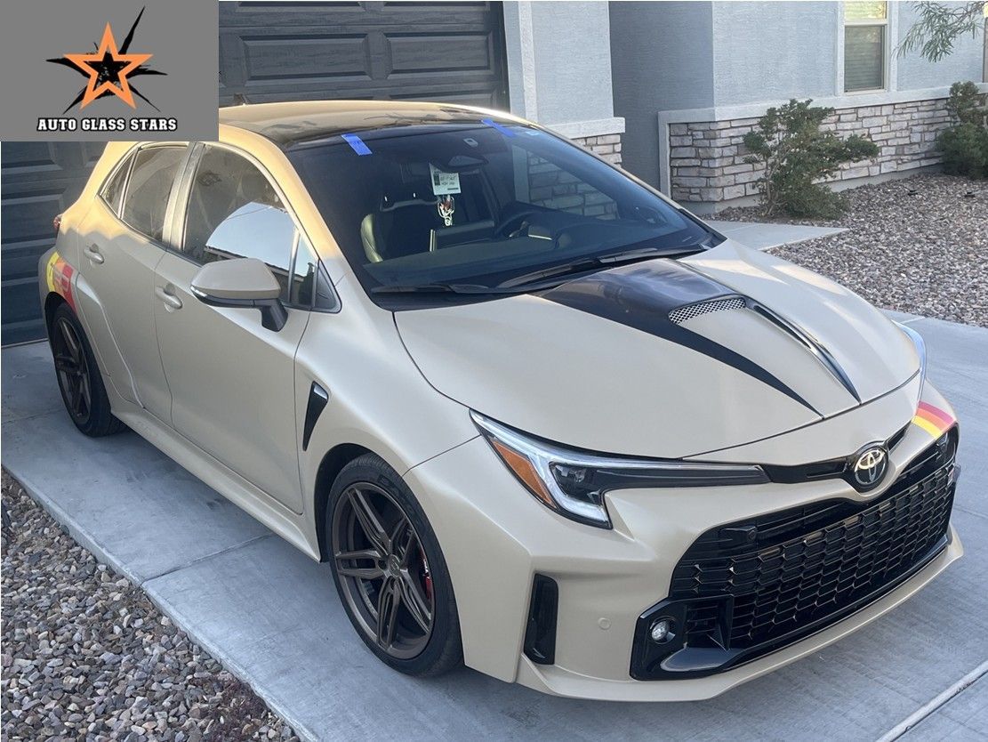 New windshield installed on a tan Toyota car by Auto Glass Stars.