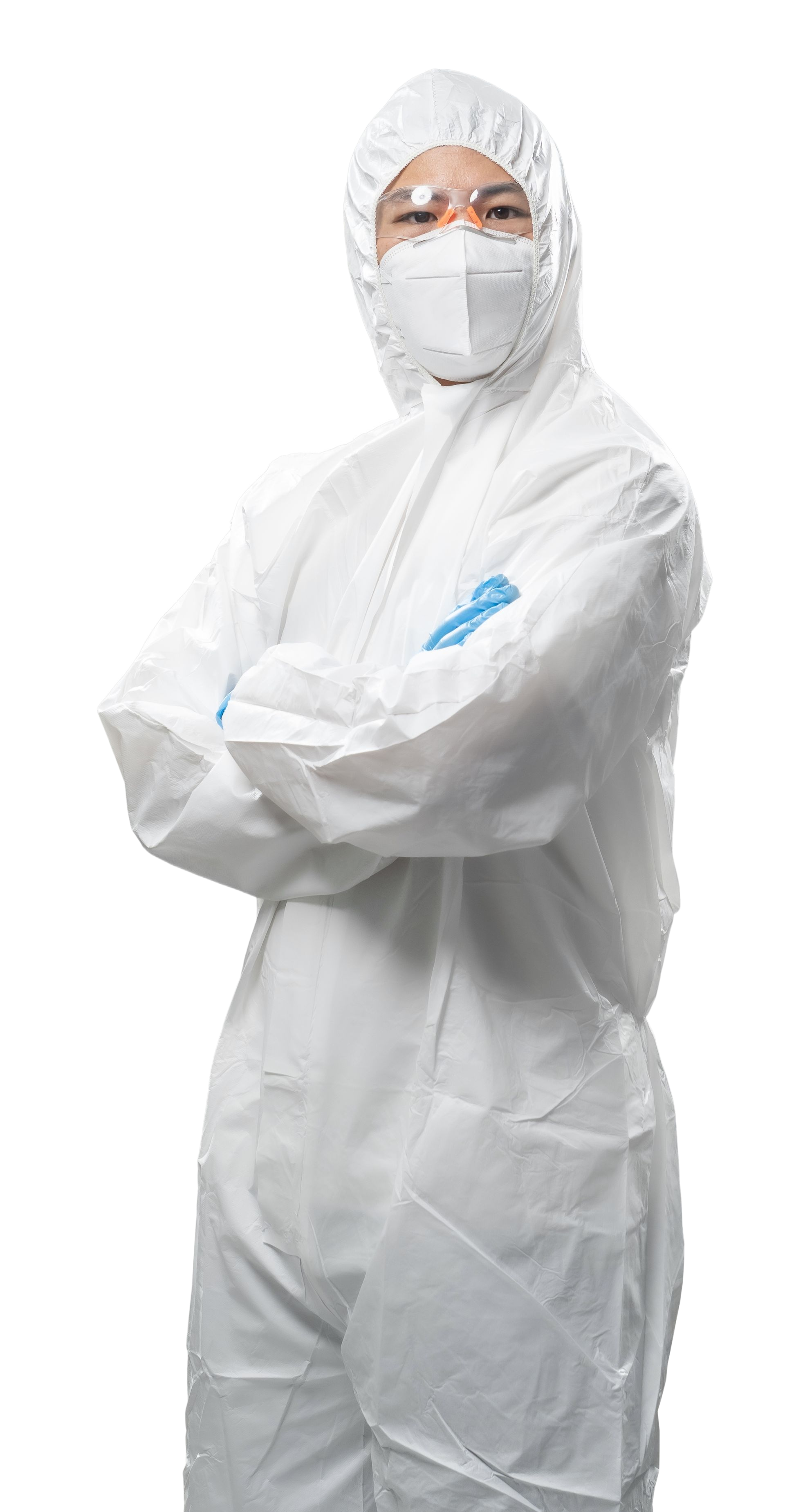 Person in white protective suit, mask, and goggles, arms crossed.