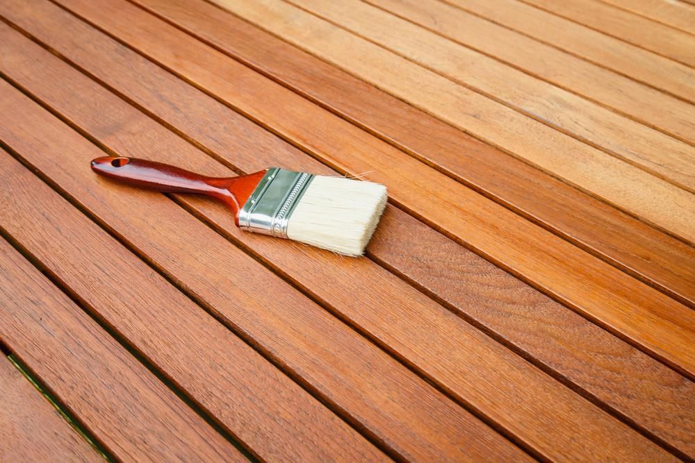 A Brush Is Sitting On Top Of A Wooden Table — Paint & Trade Supplies Lismore In Casino, NSW