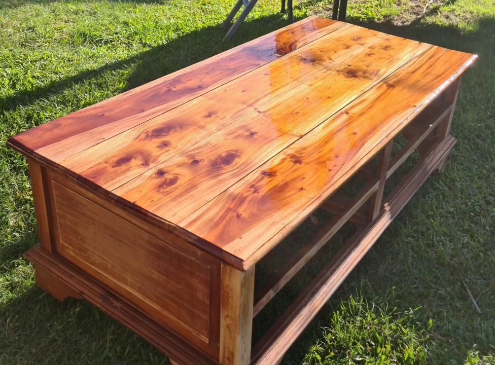 A Wooden Table Is Sitting On Top Of A Lush Green Field — Paint & Trade Supplies Lismore In Goonellabah, NSW