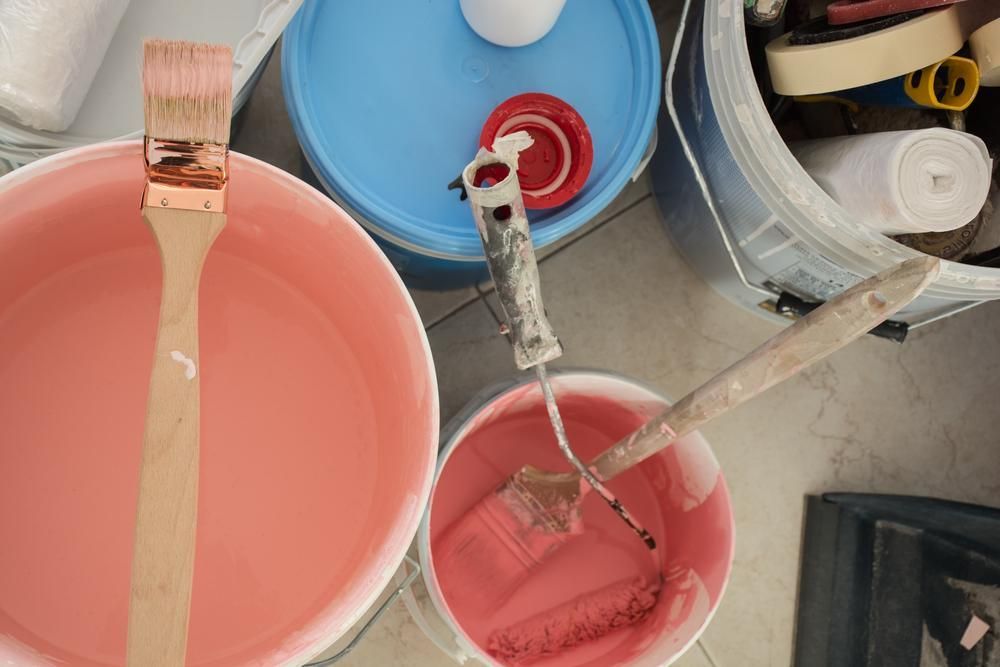 A Bucket Of Pink Paint With A Brush In It — Paint & Trade Supplies Lismore In Bangalow, NSW