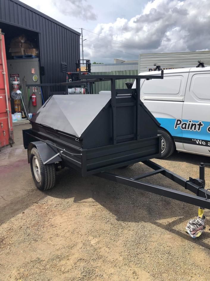 A Trailer Is Parked In Front Of A Building Next To A Van — Paint & Trade Supplies Lismore In Goonellabah, NSW