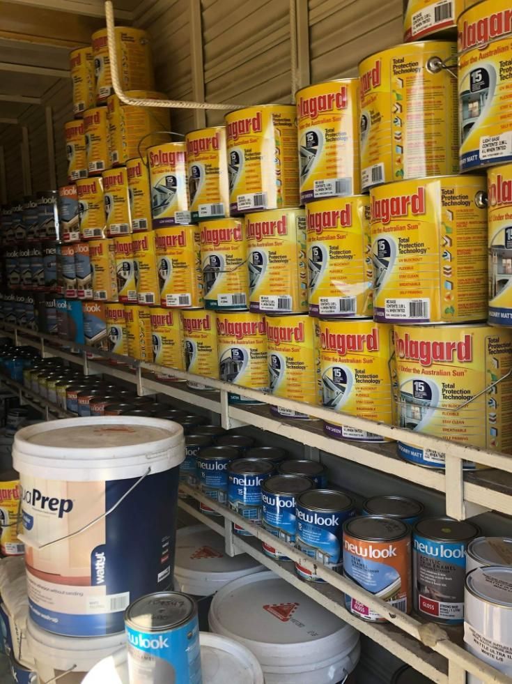 A Warehouse Filled With Lots Of Cans Of Paint And Buckets — Paint & Trade Supplies Lismore In Goonellabah, NSW