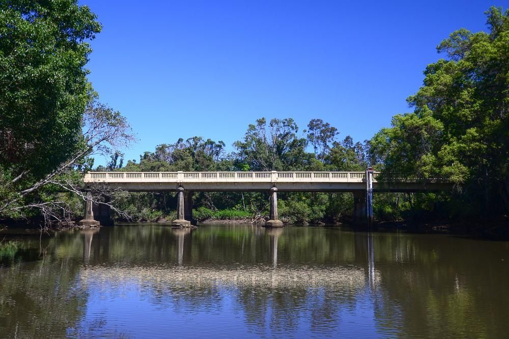 A Bridge Over A River With Trees In The Background — Paint & Trade Supplies Lismore In Brunswick Heads, NSW