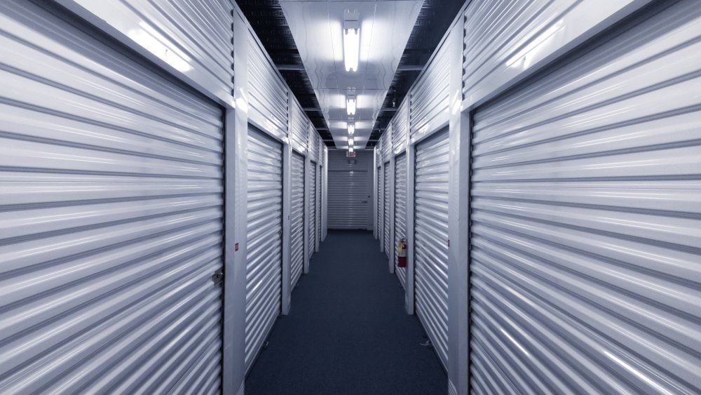 Storage Units on a Blue Carpeted Hallway — Hennig Electrical Services  in Nambour, QLD