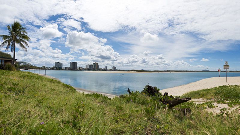 A Beach With a City in the Background — Hennig Electrical Services in Maroochydore, QLD