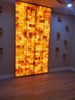 A room with a brick wall that is lit up