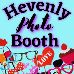 A sign for Hevenly Photo Booth surrounded by props