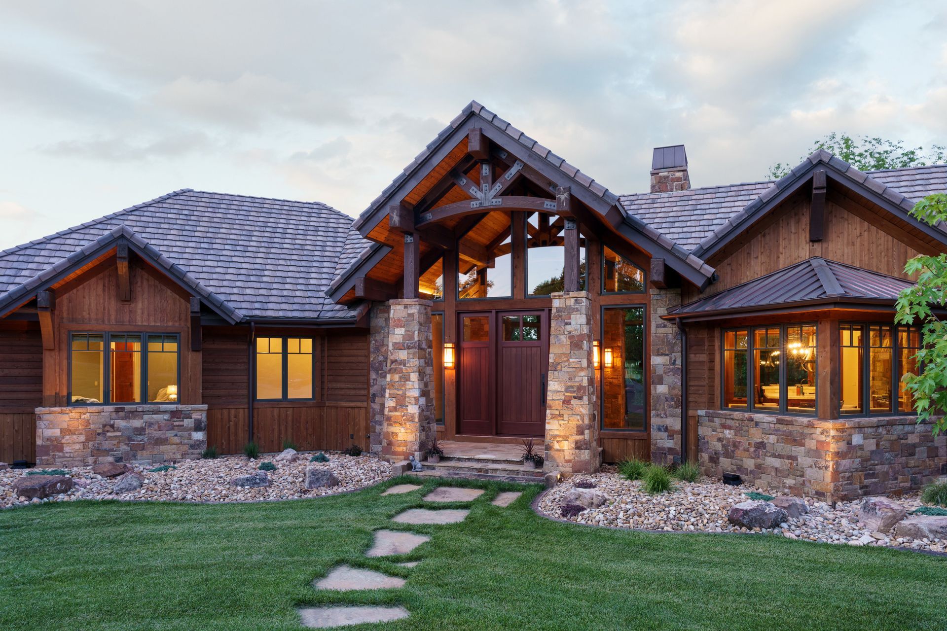 A large house with a stone walkway leading to it
