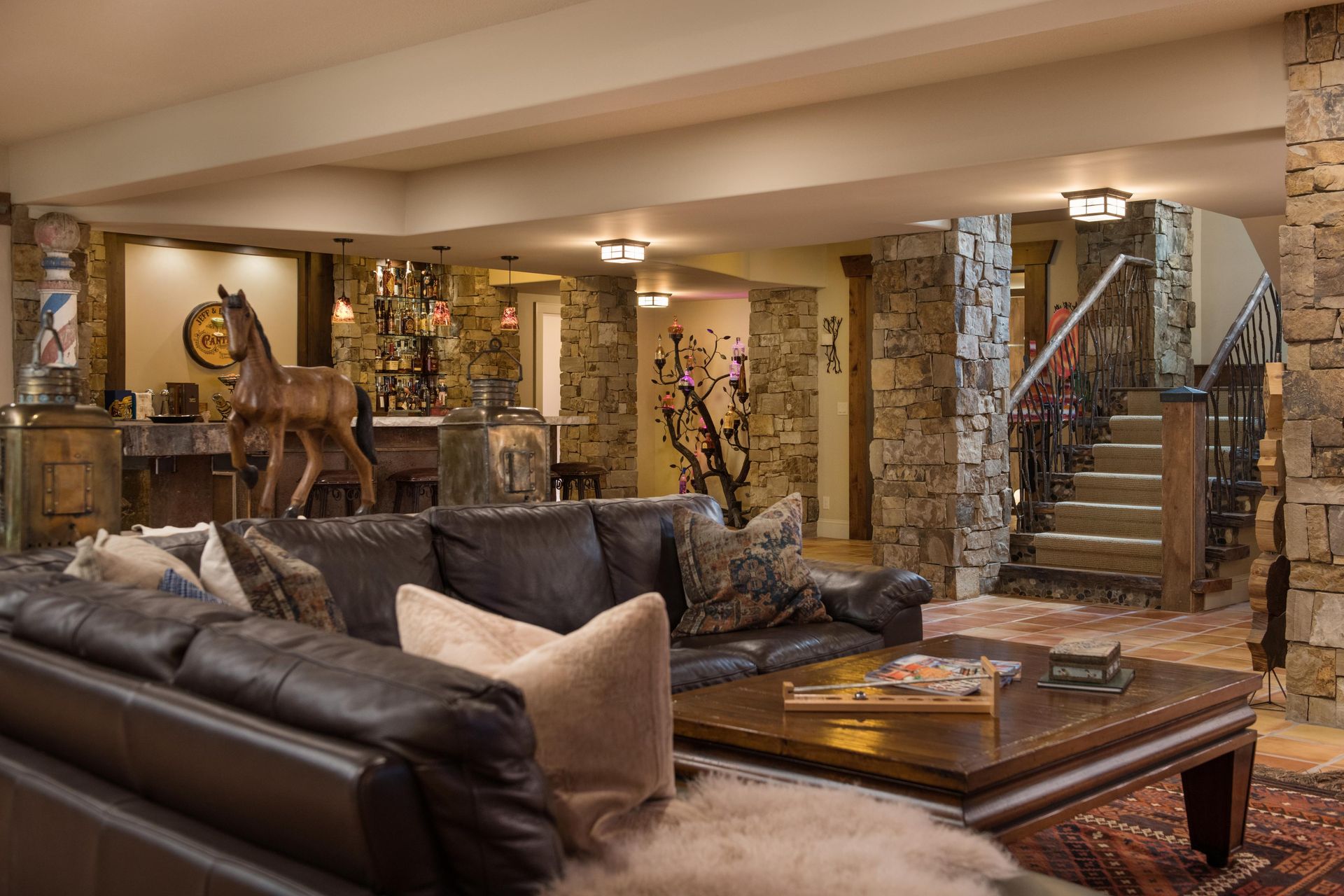 A large brick house with a white garage door and a lush green lawn