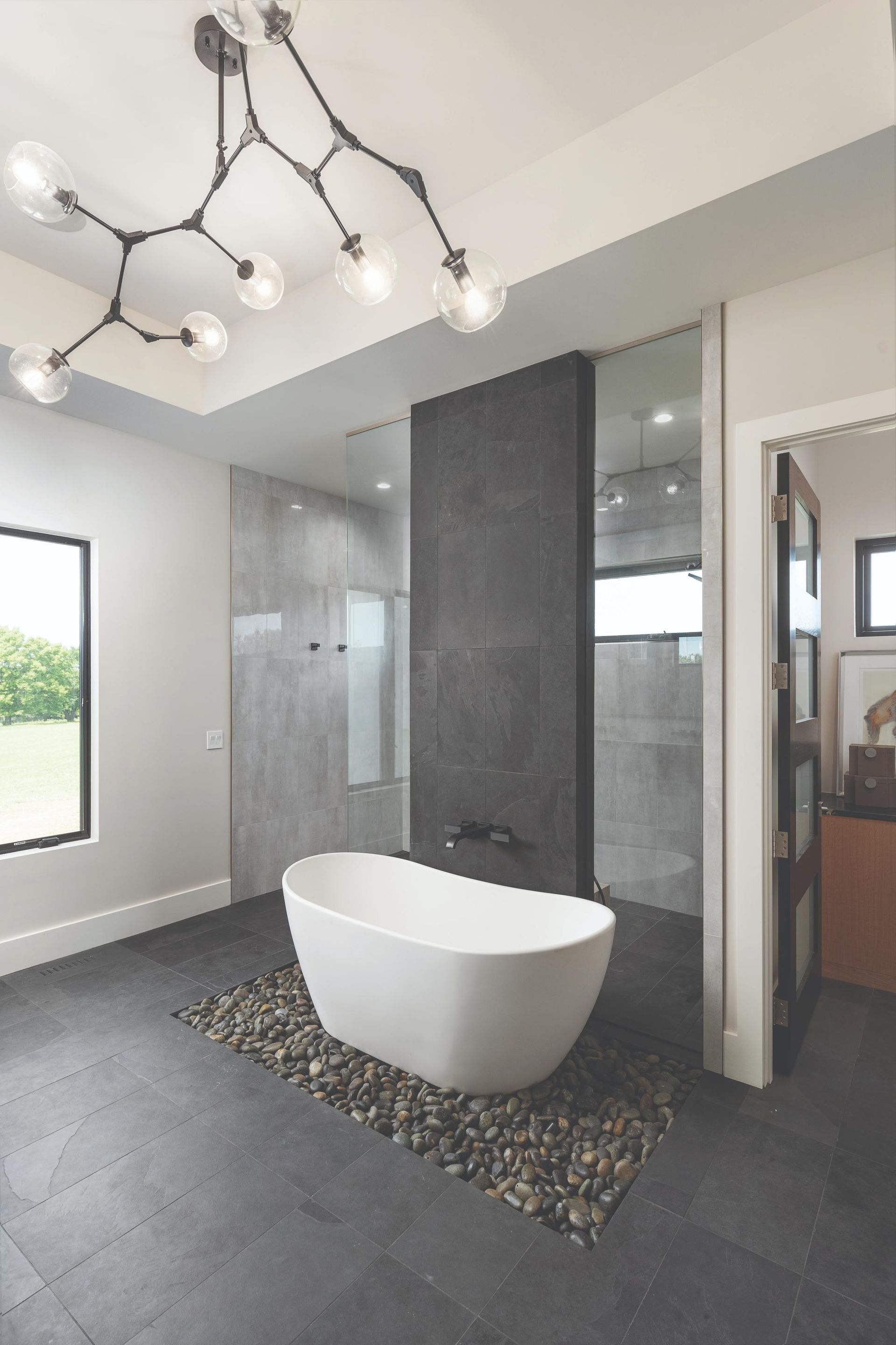 There is a bathtub in the middle of the bathroom.