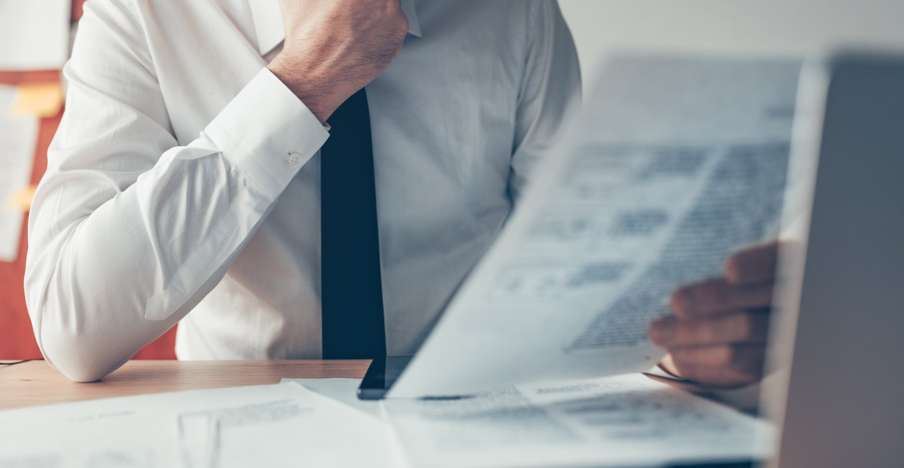 closeup of man reading document