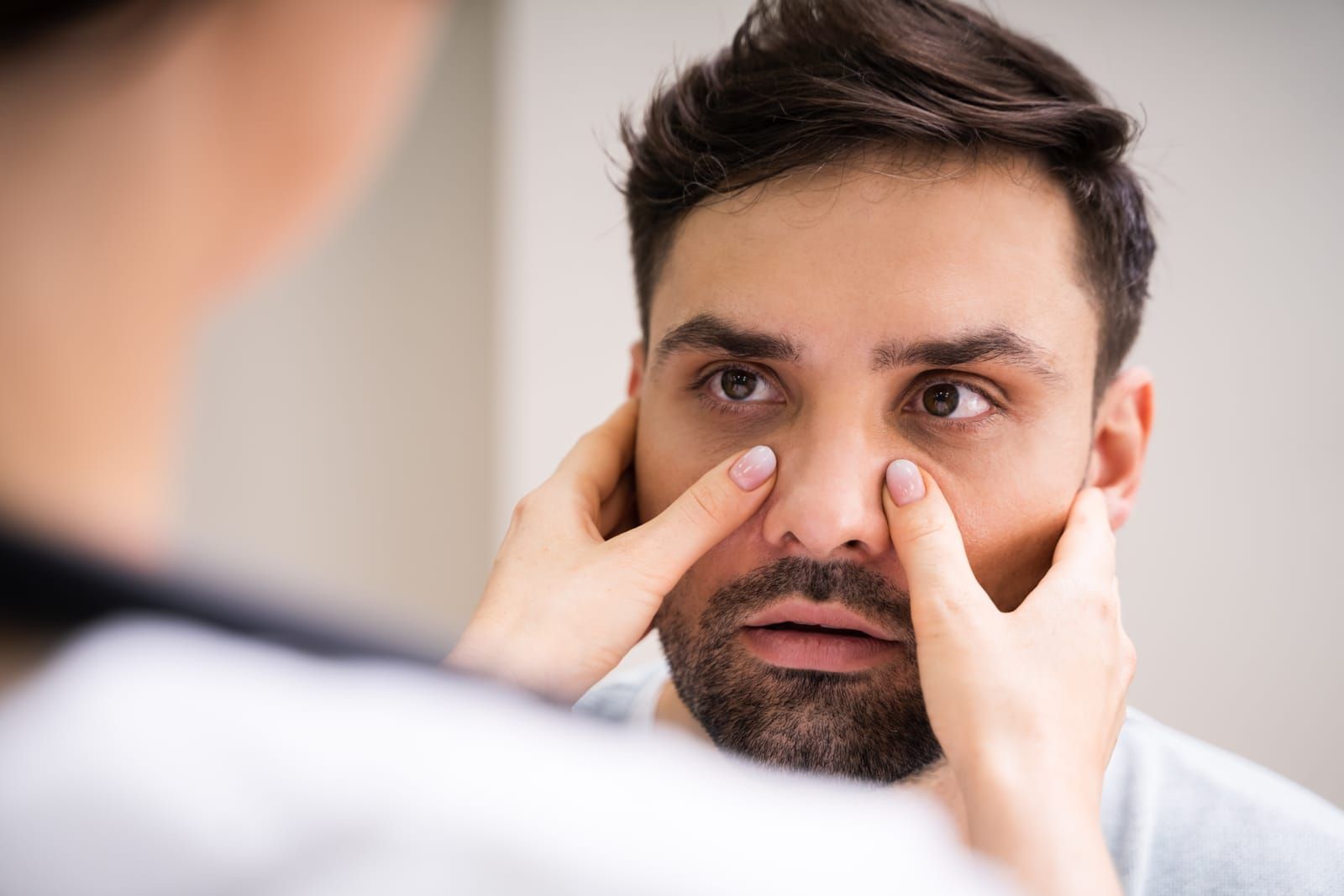 physician-doctor-doing-sinusitis-examination