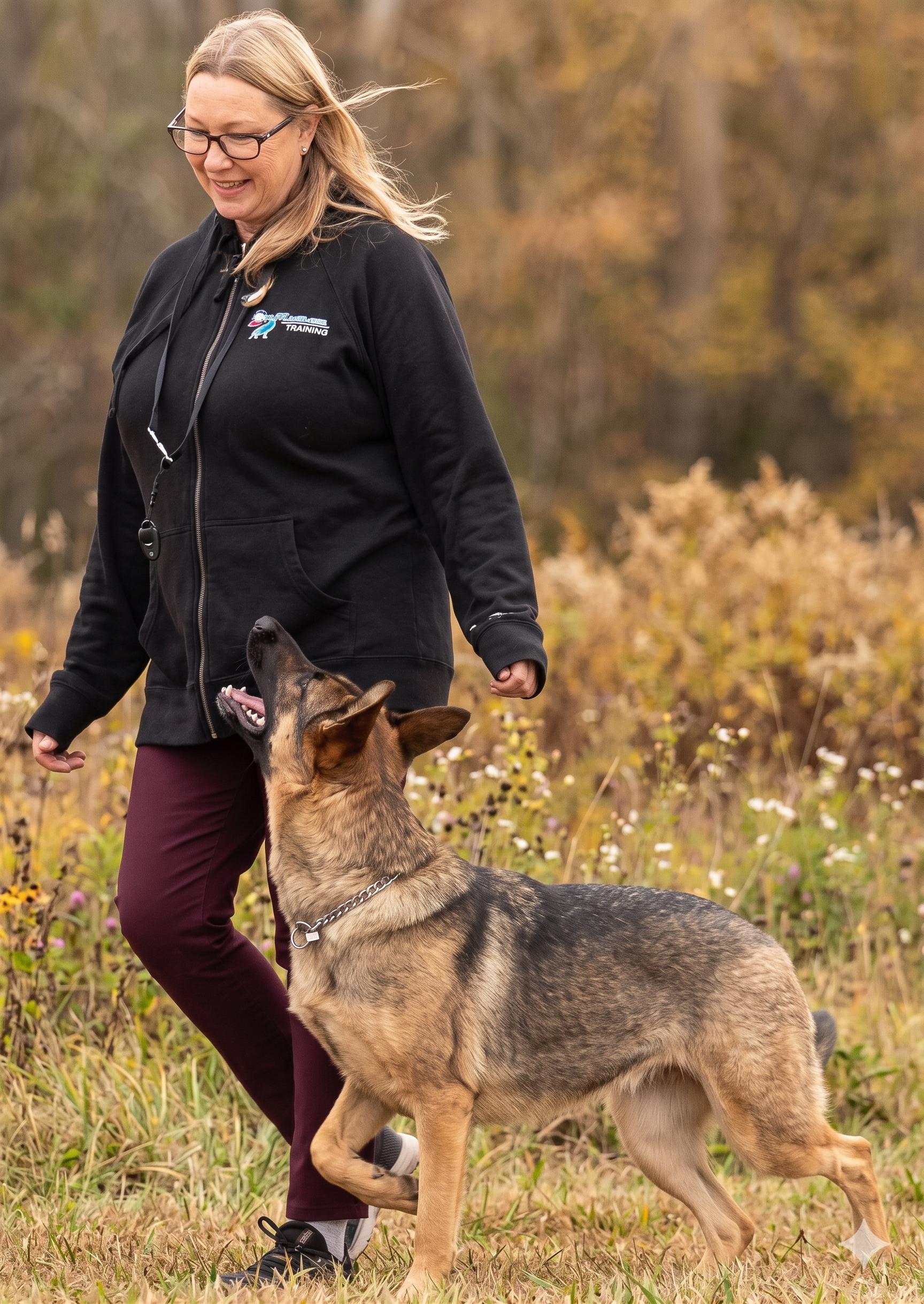 A lady and a dog is walking.
