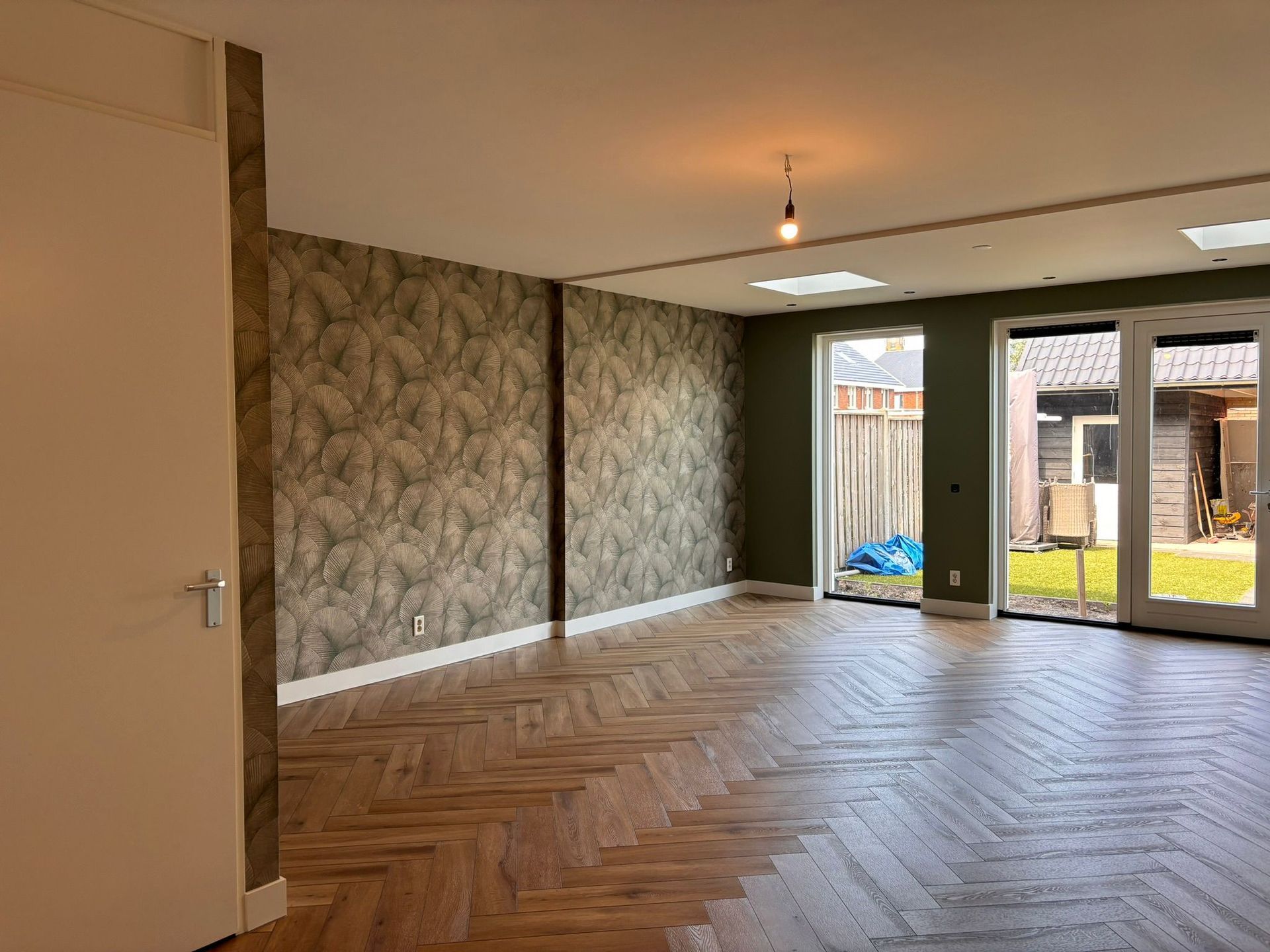 Luxe woonkamer behang en schilderwerk Kampen