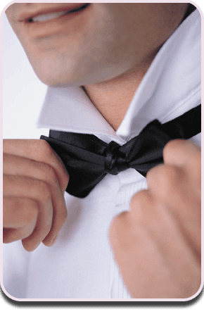 Looking for bow tie clasps in the UK? Call today on 020 8264 8066 Man knotting bow tie