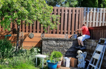 A white bathtub with chrome fixtures and a folded white towel.