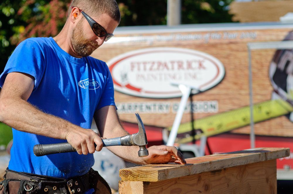 Fitzpatrick worker doing carpentry work outdoors