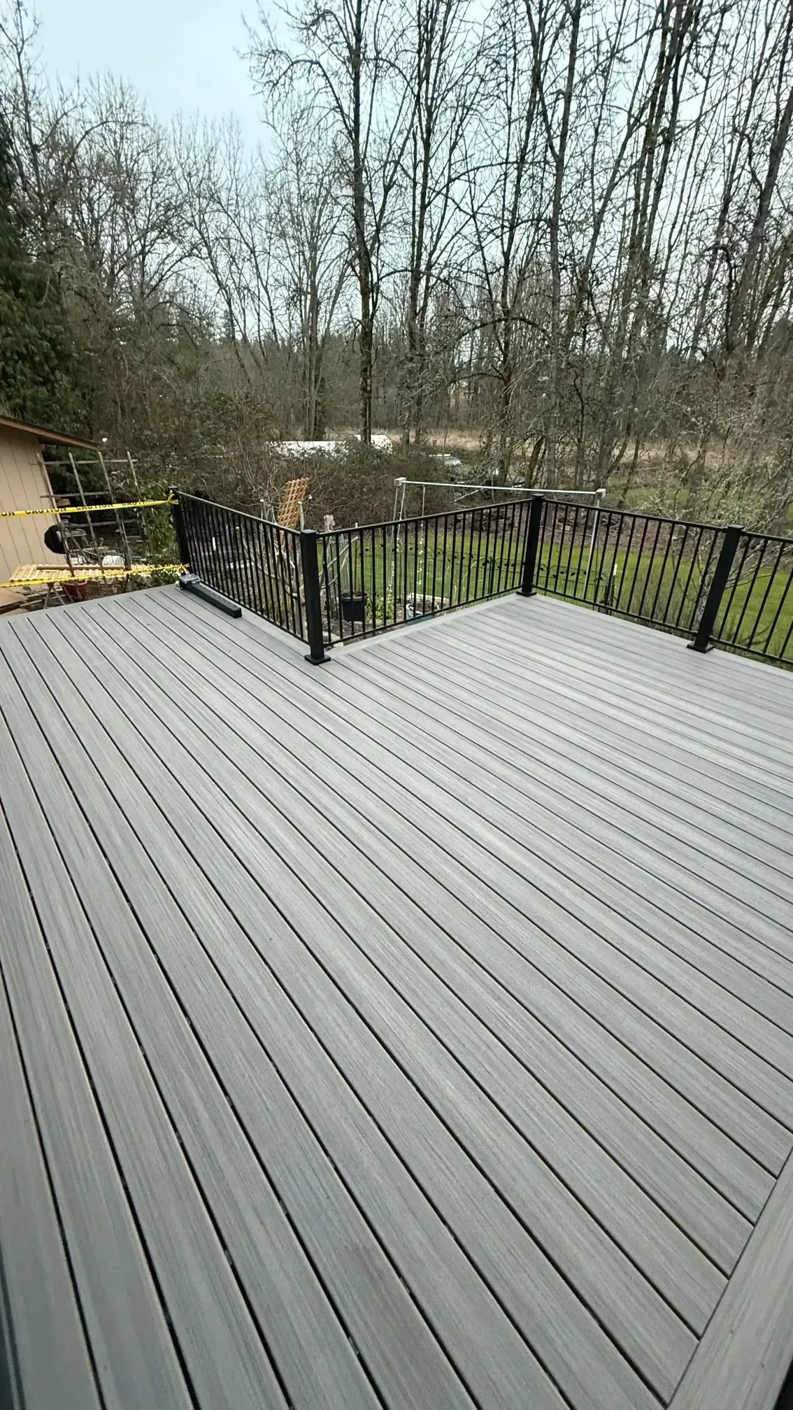 Top-down view of grey-toned decking boards.