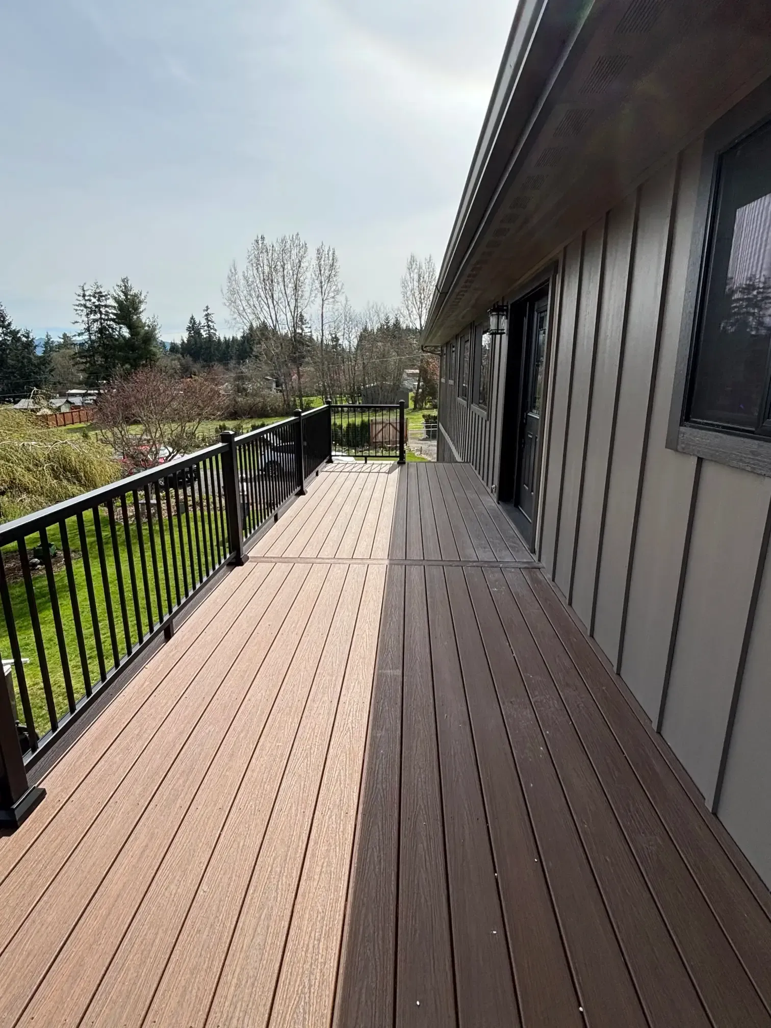 Perspective view of the deck length and railing.