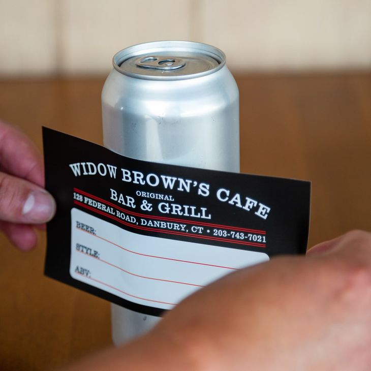 putting a label on a Crowler can