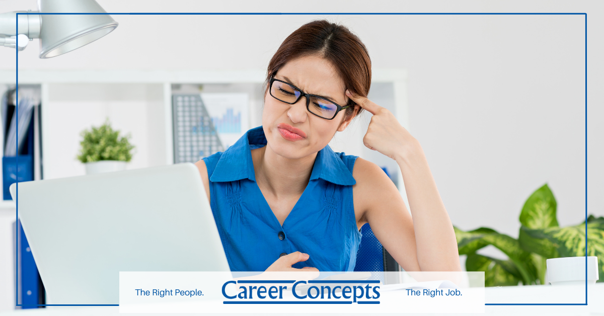 A frustrated job seeker sitting at her desk