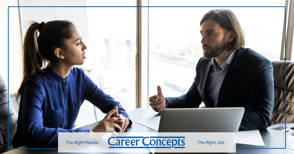 An employee talking to her boss