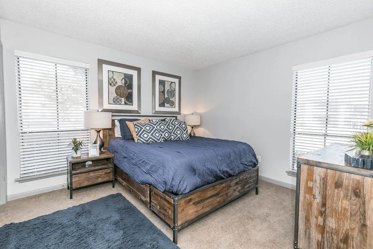 a bedroom with a large bed and two nightstands