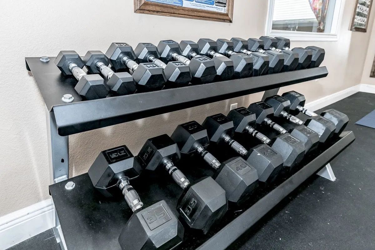 a row of dumbbells with the number 15 on them
