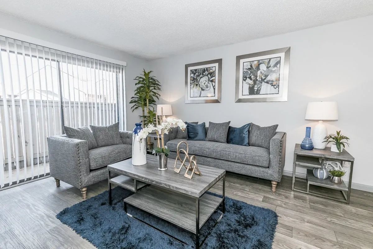 a living room with a couch and two chairs